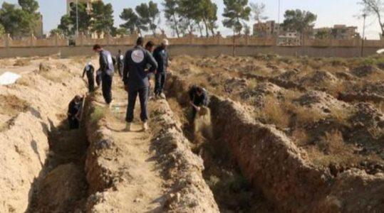 Hundreds of bodies found in mass graves near former ISIS stronghold