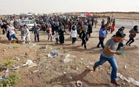 ISIS terrorists try to run from the battlefield with civilians fleeing in the besieged Mosul