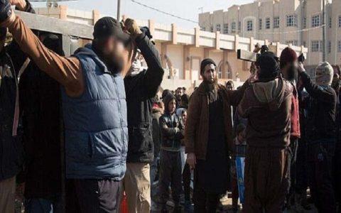 Two men are publicly crucified by ISIS barbarians for trying to bring tobacco into Mosul