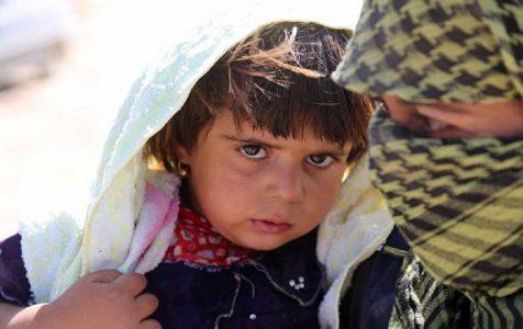 Woman risks backlash to care for ISIS children