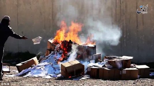ISIS burns hundreds of Christian books in Mosul