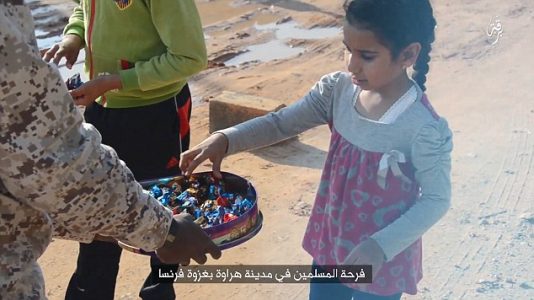 ISIS hand out sweets to children in sickening celebration of Paris terror attacks