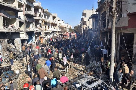 ISIS suicide bomber detonates himself in a crowd as people gather at the scene of a car bomb in Homs