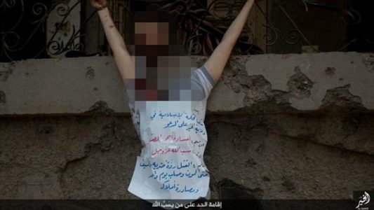 ISIS thugs behead blindfolded man and crucify his corpse in barbaric new images