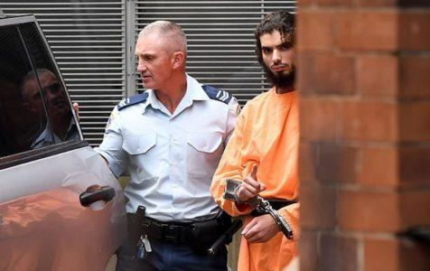Man gives the one-finger Islamic State salute after he’s found guilty of trying to join the group