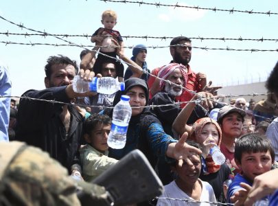 Moment hundreds of desperate Syrian refugees are frogmarched back to face death