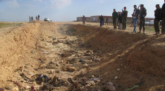 Special team exhuming Yezidi mass graves come under fire