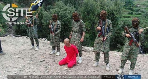 ISIS shares disturbing footage of fighters beheading a Taliban member in front of cheering children