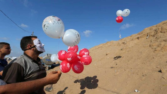 Hamas terrorists to halt explosive balloons in exchange for Israel easing blockade