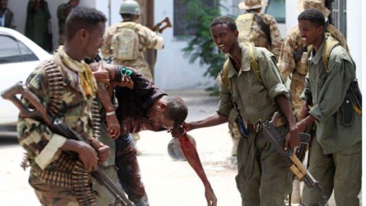 Twin car bombings claimed by al-Shabaab kill at least 19 in Somalia