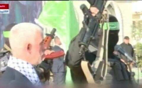 Hamas, celebrating its anniversary, brandishes gun of IDF soldier killed in 2014