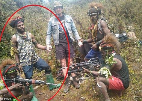 Heavily armed kidnapper pictured with New Zealand pilot